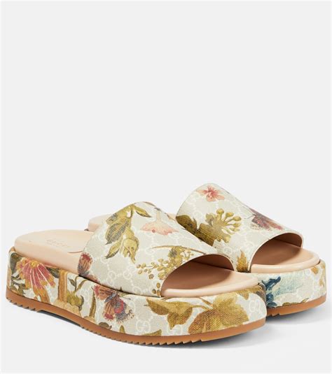 gucci flora sliders|Gucci floral platform slides.